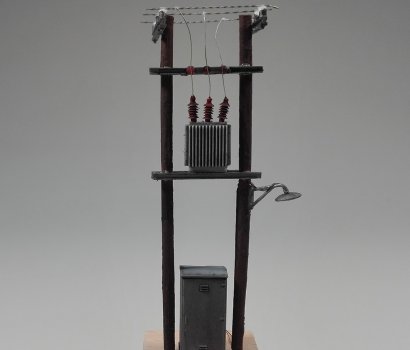 Wooden power pole miniature in HO scale with led light, ready to be installed to your diorama.